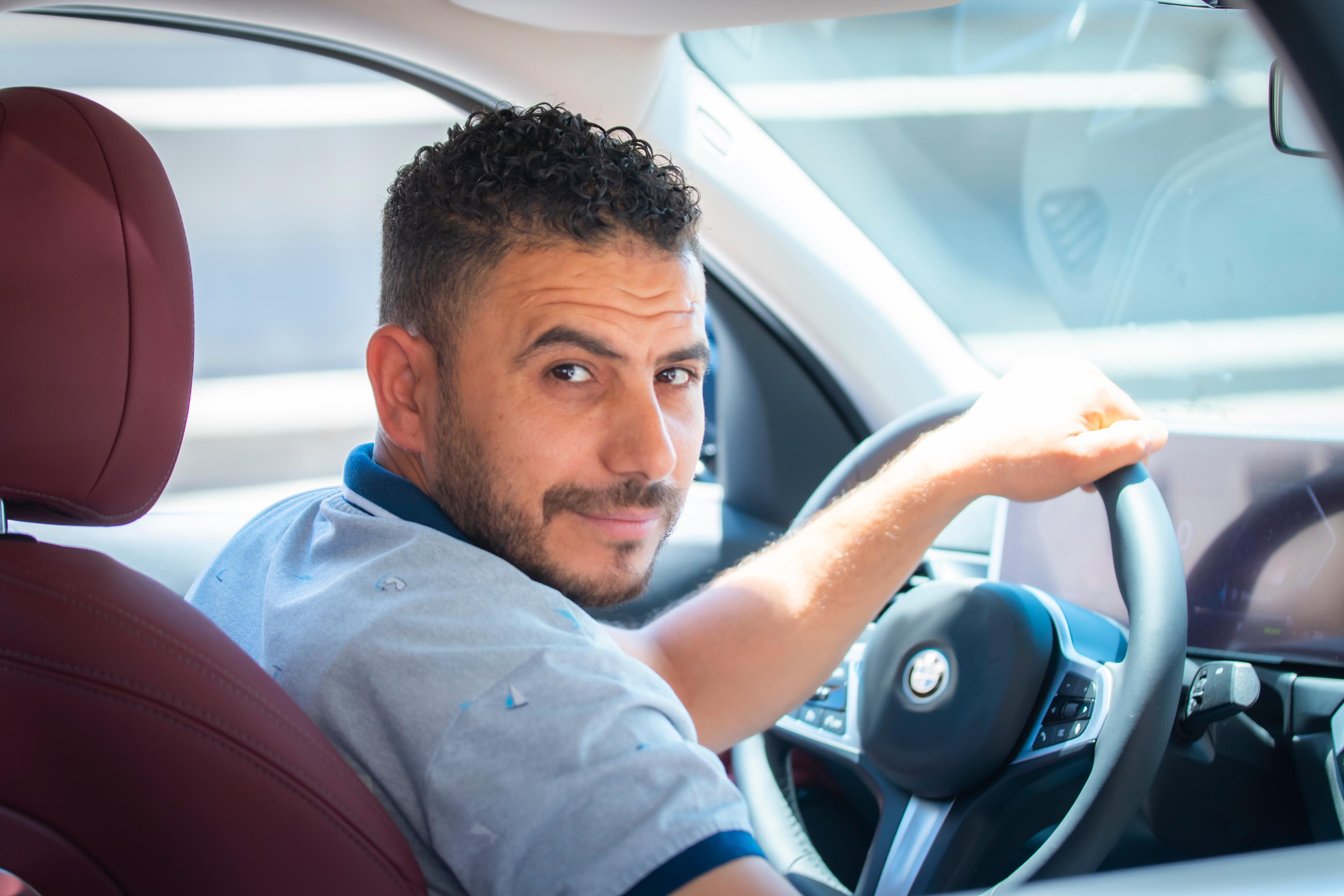 Man driving and looking